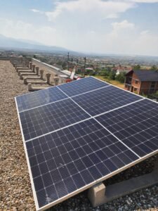 Flat rooftop installation using ballasted mounting system, ensuring stability without roof penetration.